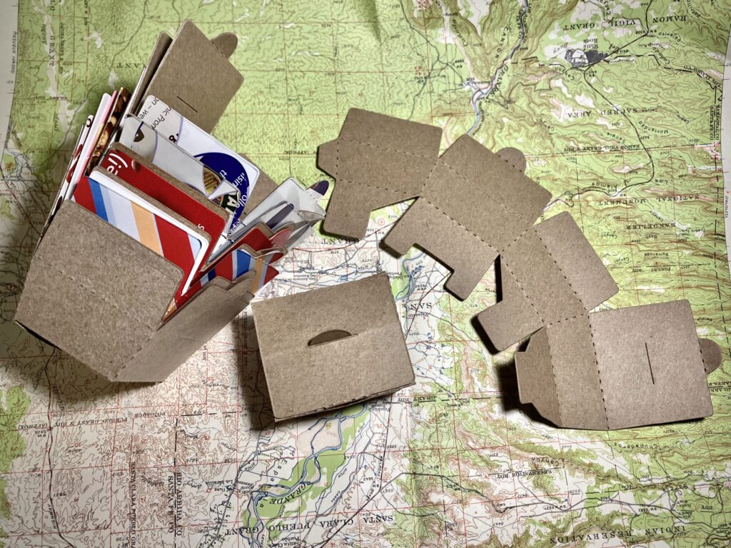 stacking cereal box gift boxes on the background of a recycled map